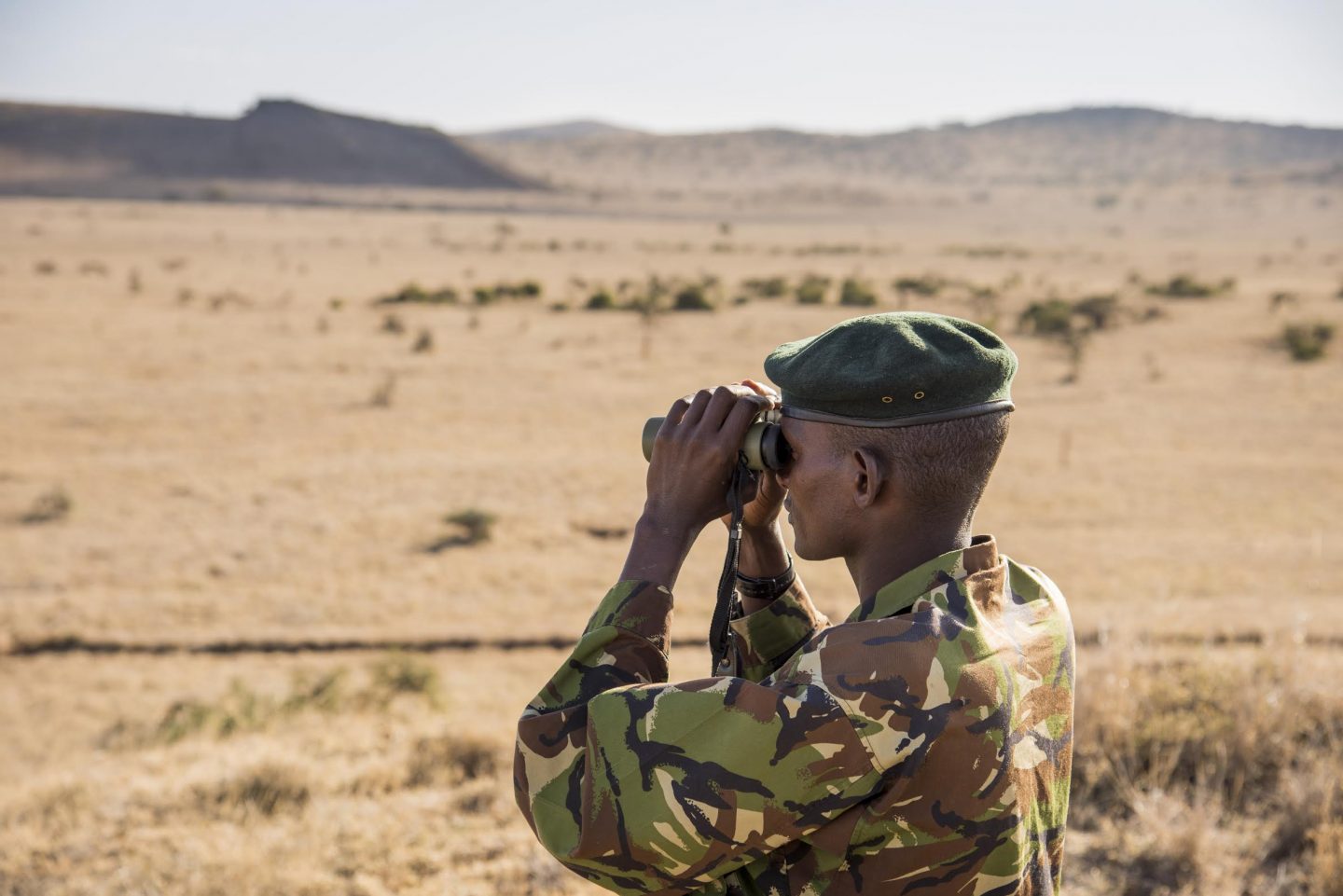 Tusk Trust - The Lewa Wildlife Conservancy Security ranger with binoculars © Frank Petersen